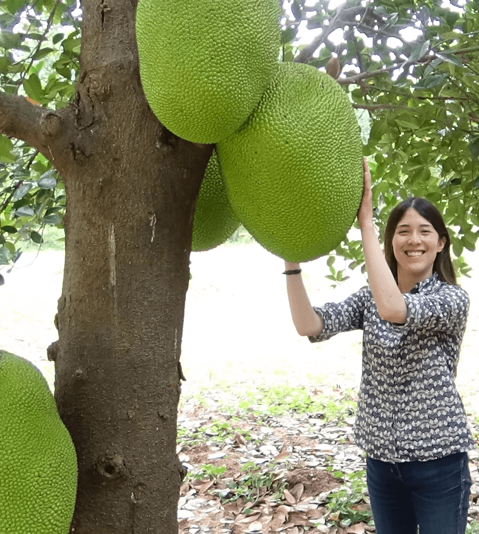 women holding jackfruit