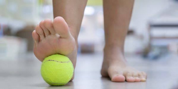 Tennis Ball to Relax Your Foot Muscles