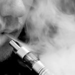 A man using a vaping device