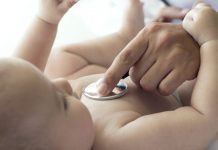 doctor checking baby