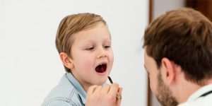 close-up-doctor-checking-kid-s-mouth