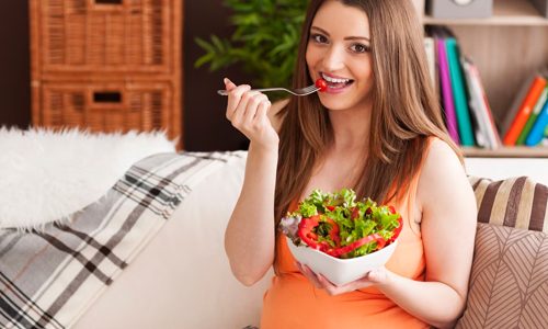 A woman eating vitamin B foods