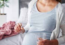 A pregnant woman taking folic acid