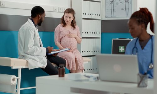 A woman consults with the doctor
